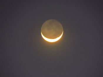 Low angle view of moon against sky at night