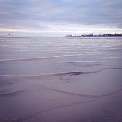 Scenic view of sea against cloudy sky