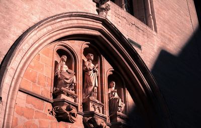 Low angle view of statues on building