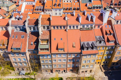 Warsaw, poland red orange roof in old town market square town architecture windows rooftop