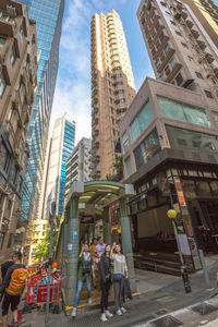 Low angle view of buildings in city against sky