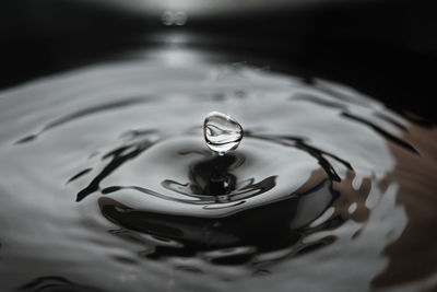 High angle view of water drop in container