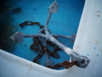 High angle view of rusty chain on wall