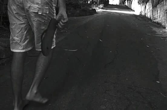 LOW SECTION OF MAN WITH WOMAN STANDING ON STREET