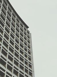 Low angle view of office building against clear sky