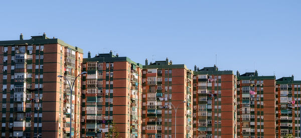 Apartment buildings against clear sky