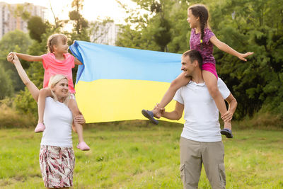 Family with the flag of ukraine