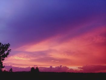 Scenic view of silhouette landscape against romantic sky at sunset