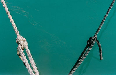 Low angle view of rope against sea