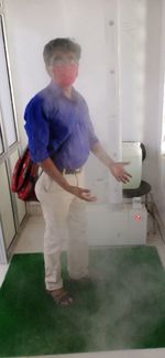 Rear view of man standing at home