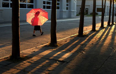 Woman walking on footpath