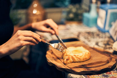 Midsection of man preparing food