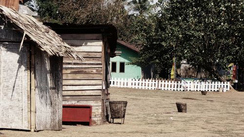 Exterior of house by trees against sky