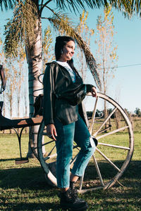 Elegant young woman posing fashionable outdoors