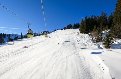 Scenic view of snow covered landscape against sky