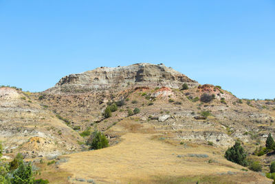 Scenic view of mountain against clear blue sky