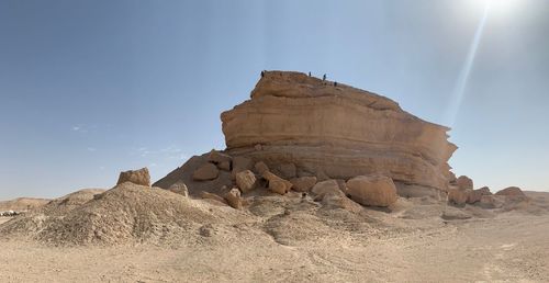 Rock formations in desert against sky