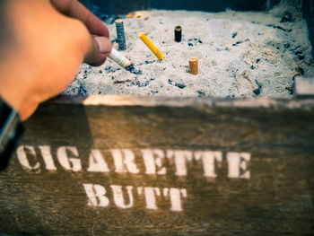Human hand holding cigarette