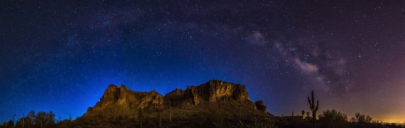 Low angle view of lightning against star field at night