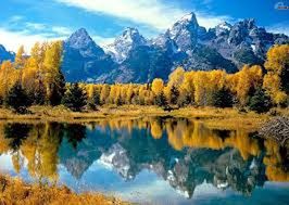 SCENIC VIEW OF LAKE WITH MOUNTAINS IN BACKGROUND