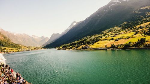 Scenic view of lake and mountains against sky