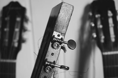 Cropped image of guitar tuning peg