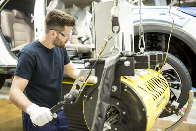 Man working in modern car factory