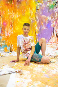 Portrait of boy covered in paint