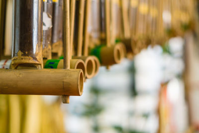 Close-up of cross hanging on wood