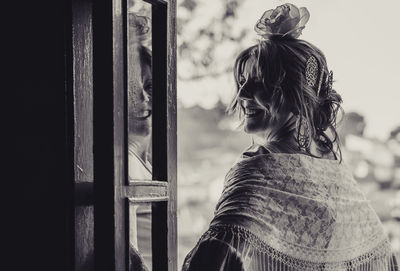 Portrait of woman standing outdoors