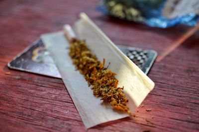 Close-up of weed on table