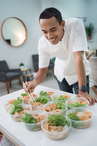 Man preparing food on table