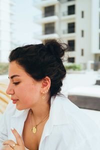 Side view of young woman looking away