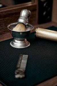 Close-up of gavel on table