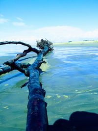 Close-up of sea against blue sky
