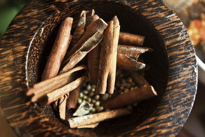 Close up. various colorful spices in a bowl of wood. cinnamon, cloves, badiane, white pepper