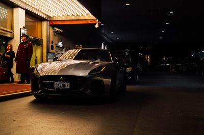 Car in illuminated city