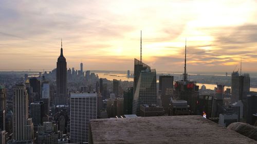 Cityscape against sky during sunset