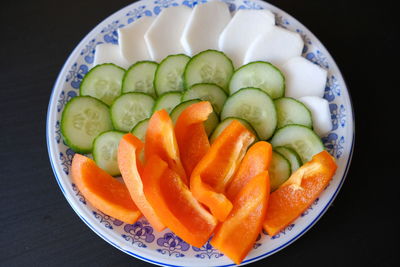 High angle view of chopped vegetables in bowl on table