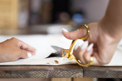 Cropped hand of woman holding key