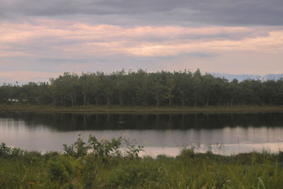 Scenic view of lake against sky during sunset