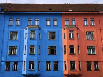 Half orange half blue block of flats in vienna, austria