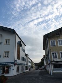 View of buildings against cloudy sky