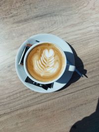 High angle view of cappuccino on table
