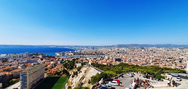 High angle shot of townscape against clear blue sky