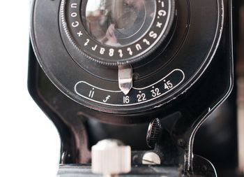 Cropped image of camera over white background