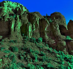 Low angle view of rock formation against sky