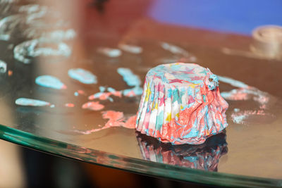 Close-up of multi colored candies on table