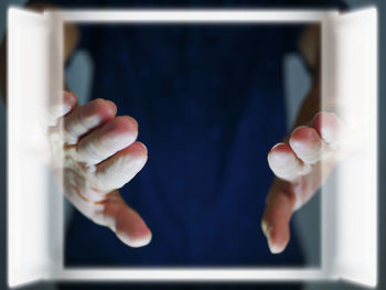 Cropped hand of person using mobile phone