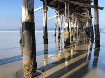 Pier on sea against sky